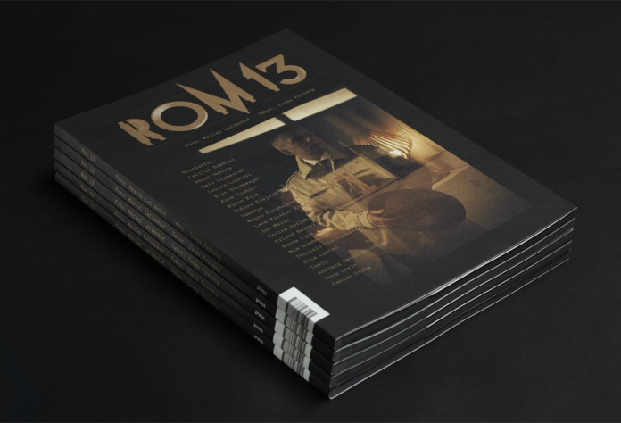 Close-up of title typography, custom made for the project. It illustrates the title (Norwegian “rom” meaning “room” in English) with a geometric construction, similar to the architecture of the warehouse in which it is displayed. Printed in metallic with embossing.